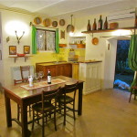 living room with kitchenette and garden