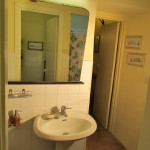 ante-bathroom with bathroom and shower in the mirror